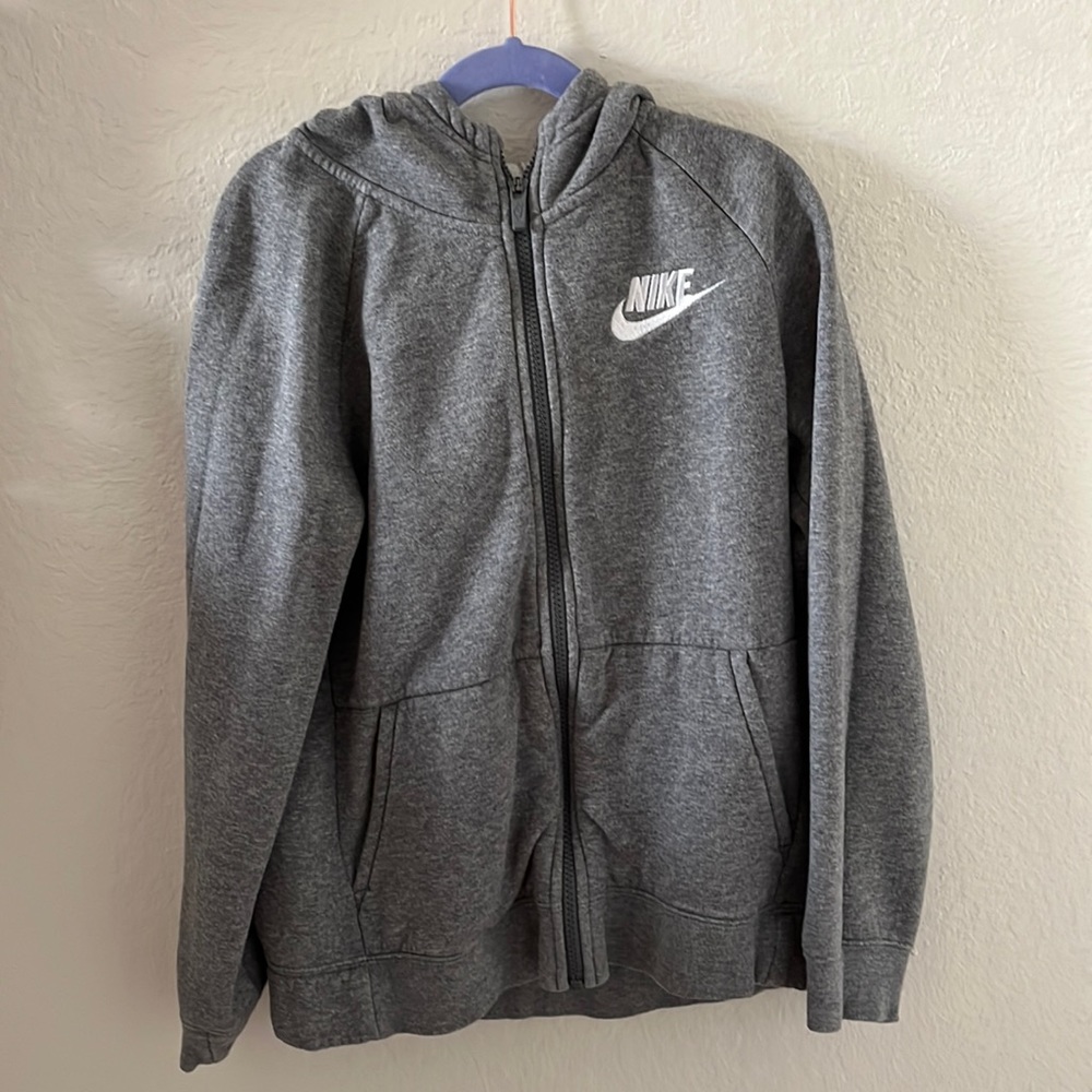 Selling Child Large gray zip up hoodie from Nike